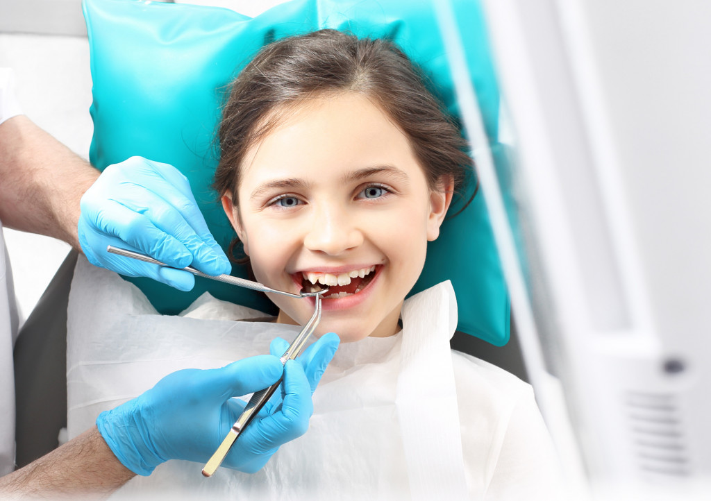 Viewed oral hygiene. Child to the dentist. Child in the dental chair dental treatment during surgery.