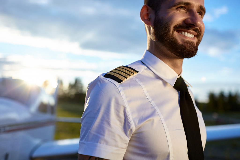 smiling aviation pilot in uniform