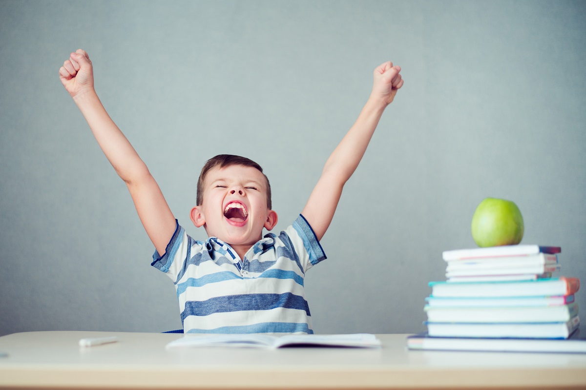 happy male child while studying